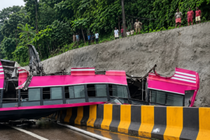 Kuttippuram accident spot showing police and NATPAC officials inspecting the service road where the private bus sped at 130 km/h.